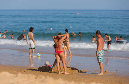 VILA DO BISPO, PORTUGAL: People at the famous beach of Salema in Vila do Bispo. This beach is a part of famous tourist region of Algarve.のeditorial素材