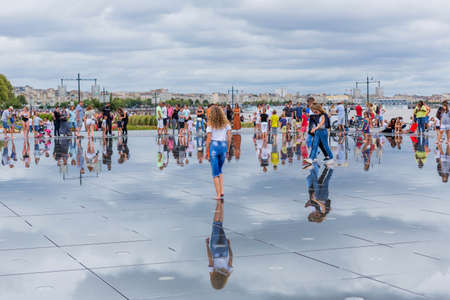 BORDEAUX, FRANCE: The Famous Bordeaux water mirror full of people having fun in the water, in Bordeaux, France.のeditorial素材