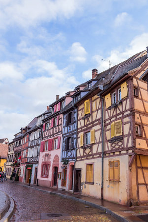 COLMAR, FRANCE: people visit the traditional buildings in the old town of Colmar.のeditorial素材