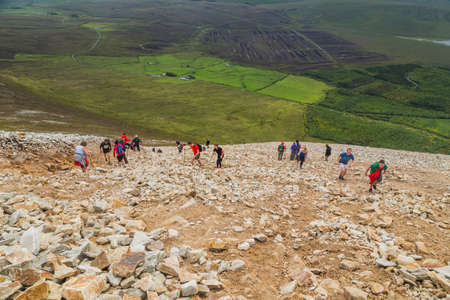 Trail, Rocks and vegetation at Croagh Patrick mountain with Westport in background, Westport, Irelandのeditorial素材