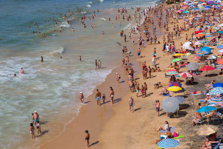 ALBUFEIRA, PORTUGAL: People at the famous beach of Olhos de Agua in Albufeira. This beach is a part of famous tourist region of Algarve.のeditorial素材