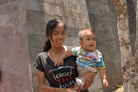 Bali, Indonesia: Mother and baby in rural Bali, Bali Island, Indonesiaのeditorial素材