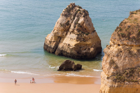 PRAIA DA ROCHA, PORTUGAL: People at the famous beach of Praia da Rocha in Portimao. This beach is a part of famous tourist region of Algarve.のeditorial素材