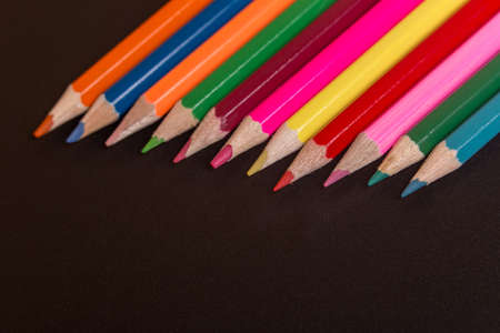 Wooden colorful pencils, on a dark backgroundの写真素材
