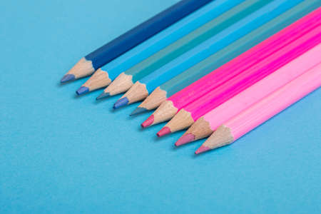 Wooden colorful pencils, on a blue backgroundの写真素材