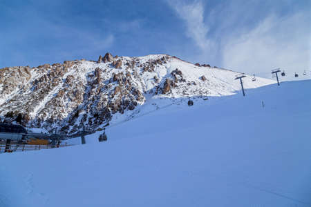 Winter Snowy Mountains with sun in Ak Bulak, Almaty, Kazakhstan, Asiaの写真素材
