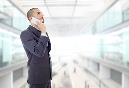 worried business man on the phone, at the officeの写真素材
