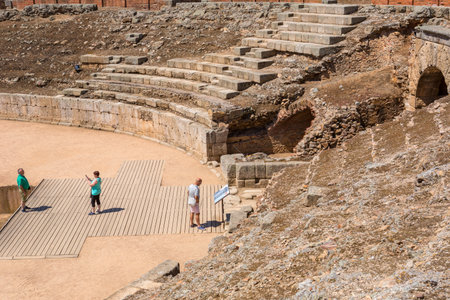 MERIDA, SPAIN: People at the Roman Amphitheater at the archaeological site of Merida. Founded by ancient Rome in western Spainのeditorial素材