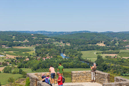 Domme, France: Tourists visiting the medieval town of Domme. Located in the Dordogne departement, occupies a splendid position high above the Dordogne valley, France.のeditorial素材