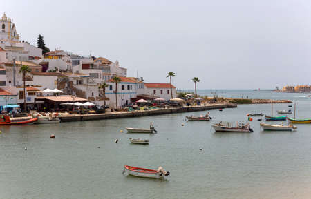 FERRAGUDO, PORTUGAL: Picturesque view of Ferragudo fishing village in Algarve, Portugalのeditorial素材