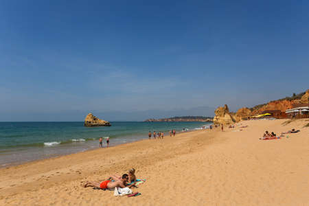 PRAIA DA ROCHA, PORTUGAL: People at the famous beach of Praia da Rocha in Portimao. This beach is a part of famous tourist region of Algarve.のeditorial素材