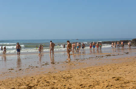 ALBUFEIRA, PORTUGAL: People at the famous beach of Olhos de Agua in Albufeira. This beach is a part of famous tourist region of Algarve.のeditorial素材