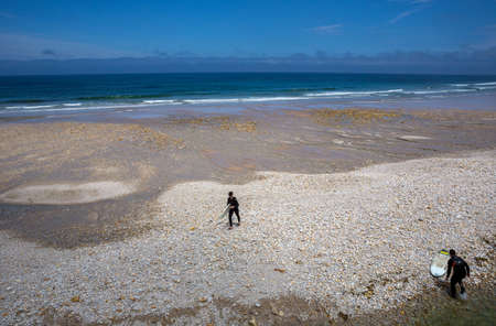 Llanes, Picos de Europa, Spain: People at the beach of San Antolin, Llanes, Asturias, Spainのeditorial素材