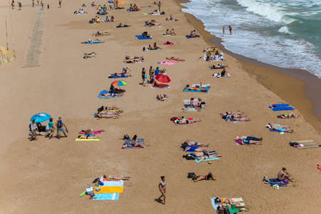 LAGOS, PORTUGAL: People at the famous beach of Praia Dona Ana in Lagos, Algarve region, Portugalのeditorial素材