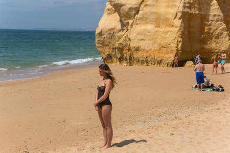 PRAIA DA ROCHA, PORTUGAL: People at the famous beach of Praia da Rocha in Portimao. This beach is a part of famous tourist region of Algarve.のeditorial素材