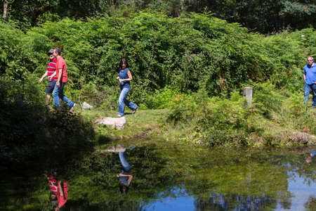PAREDES DE COURA, PORTUGAL: Group of people hiking in the nature at Paredes de Couraのeditorial素材
