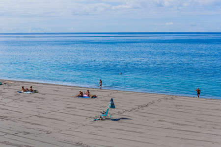 Agua de Pau, Sao Miguel island, Azores, Portugal: People at the beach sand in Agua de Pau, Azores. Sao Miguel island, Portugal.のeditorial素材