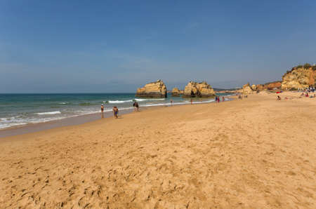 PRAIA DA ROCHA, PORTUGAL: People at the famous beach of Praia da Rocha in Portimao. This beach is a part of famous tourist region of Algarve.のeditorial素材