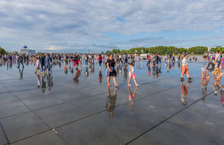 BORDEAUX, FRANCE: The Famous Bordeaux water mirror full of people having fun in the water in Bordeaux, France.のeditorial素材