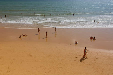 ALBUFEIRA, PORTUGAL: People at the famous beach of Olhos de Agua in Albufeira. This beach is a part of famous tourist region of Algarve.のeditorial素材