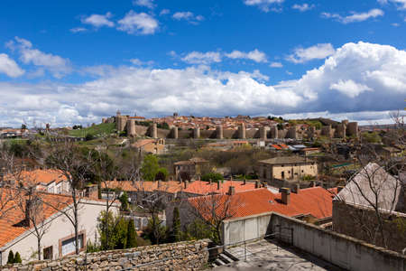 Panoramic view of the historic city of Avila from the Mirador of Cuatro Postes, Spain, with its famous medieval town walls.のeditorial素材