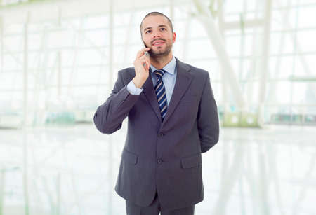 happy business man on the phone, at the officeの写真素材