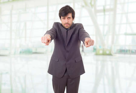 young business man pointing, at the officeの写真素材