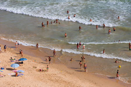 ALBUFEIRA, PORTUGAL: People at the famous beach of Olhos de Agua in Albufeira. This beach is a part of famous tourist region of Algarve.のeditorial素材