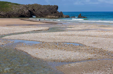 Llanes, Picos de Europa, Spain: People at the beach of San Antolin, Llanes, Asturias, Spainのeditorial素材