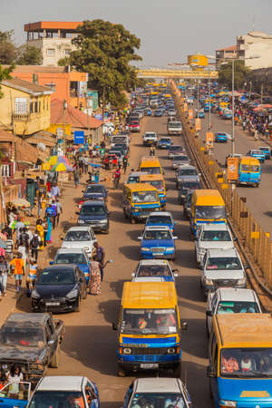 Bissau, Republic of Guinea-Bissau: Street scene in the city of Bissau with cars in a road, Guinea Bissauのeditorial素材