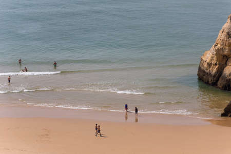 PRAIA DA ROCHA, PORTUGAL: People at the famous beach of Praia da Rocha in Portimao. This beach is a part of famous tourist region of Algarve.のeditorial素材
