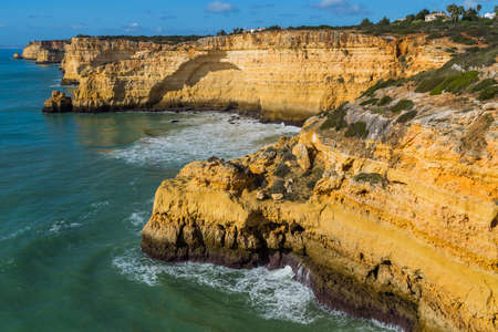 Coastal cliffs of Algarve, Lagoa, Portugalの写真素材