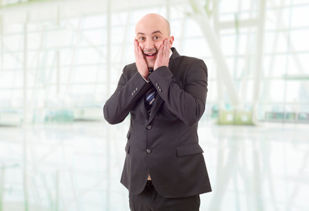 surprised business man at the officeの写真素材