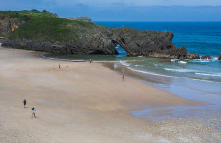 Llanes, Picos de Europa, Spain: People at the beach of San Antolin, Llanes, Asturias, Spainのeditorial素材
