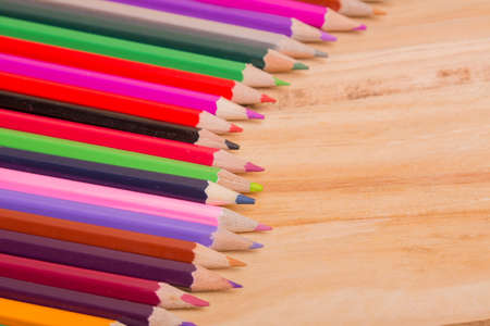 Wooden colorful pencils, on wooden tableの写真素材