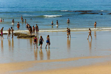 ALBUFEIRA, PORTUGAL: People at the famous beach of Olhos de Agua in Albufeira. This beach is a part of famous tourist region of Algarve.のeditorial素材