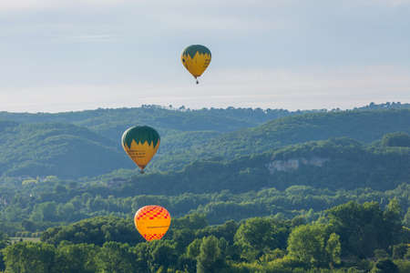 Beynac et Cazenac, Dordogne, France: Hot air balloons flying over Dordogne in southwestern Franceのeditorial素材