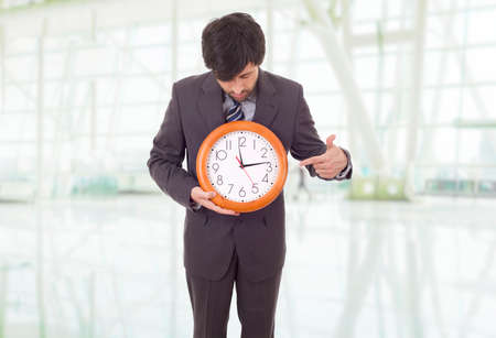 businessman with clock at the officeの写真素材