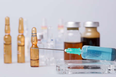 syringe with ampules of drugsの写真素材