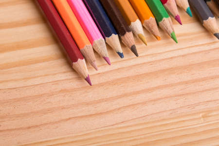 Wooden colorful pencils, on wooden tableの写真素材