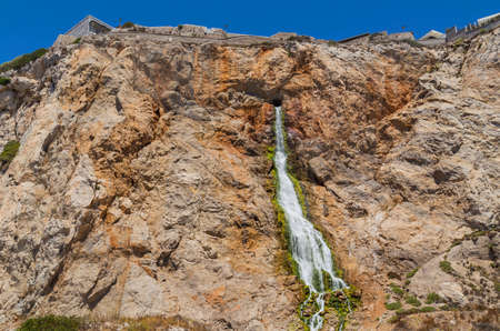Waterfall flowing out of the Rock of Gibraltarの写真素材