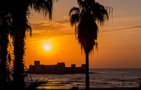 Kizkalesi castle on a small island at sunrise, Kizkalesi Maidens Castle near Mersin, Turkeyの写真素材