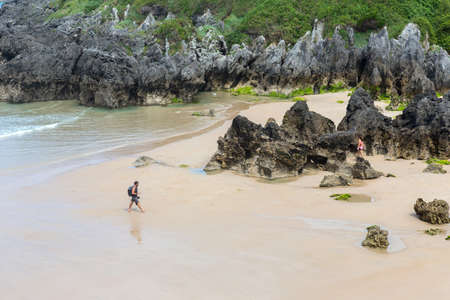 Llanes, Picos de Europa, Spain: People at the beach of Barro, Llanes, Asturias, Spainのeditorial素材