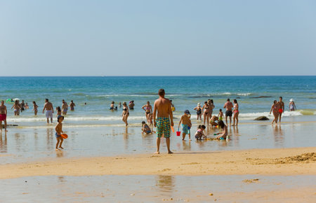 ALBUFEIRA, PORTUGAL: People at the famous beach of Olhos de Agua in Albufeira. This beach is a part of famous tourist region of Algarve.のeditorial素材
