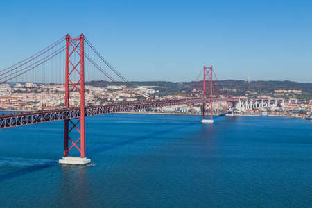 The 25 de Abril Bridge (Ponte 25 de Abril) is a suspension bridge in Lisbon over Tagus river, in Portugal.の写真素材