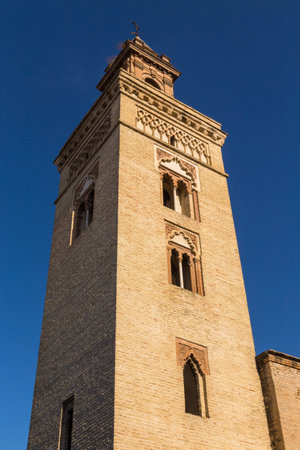 Iglesia de San Marcos Tower (Church of San Marcos) on St. Mark's Square (Plaza San Marcos) in downtown of the city Seville. Spain.の写真素材