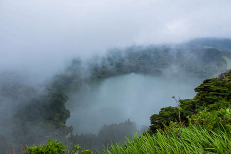 Deep lake in Flores Island, Azores Archipelago, Portugal. Green lagoon with green vegetationの写真素材