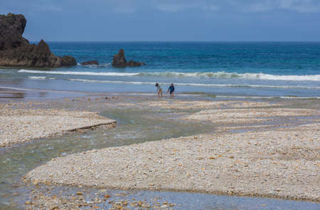 Llanes, Picos de Europa, Spain: People at the beach of San Antolin, Llanes, Asturias, Spainのeditorial素材