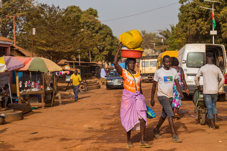 Bissau, Republic of Guinea-Bissau: Street scene in the city of Bissau with people at the street market, Guinea Bissauのeditorial素材
