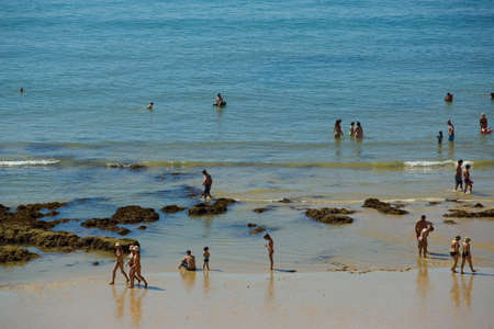 ALBUFEIRA, PORTUGAL: People at the famous beach of Olhos de Agua in Albufeira. This beach is a part of famous tourist region of Algarve.のeditorial素材